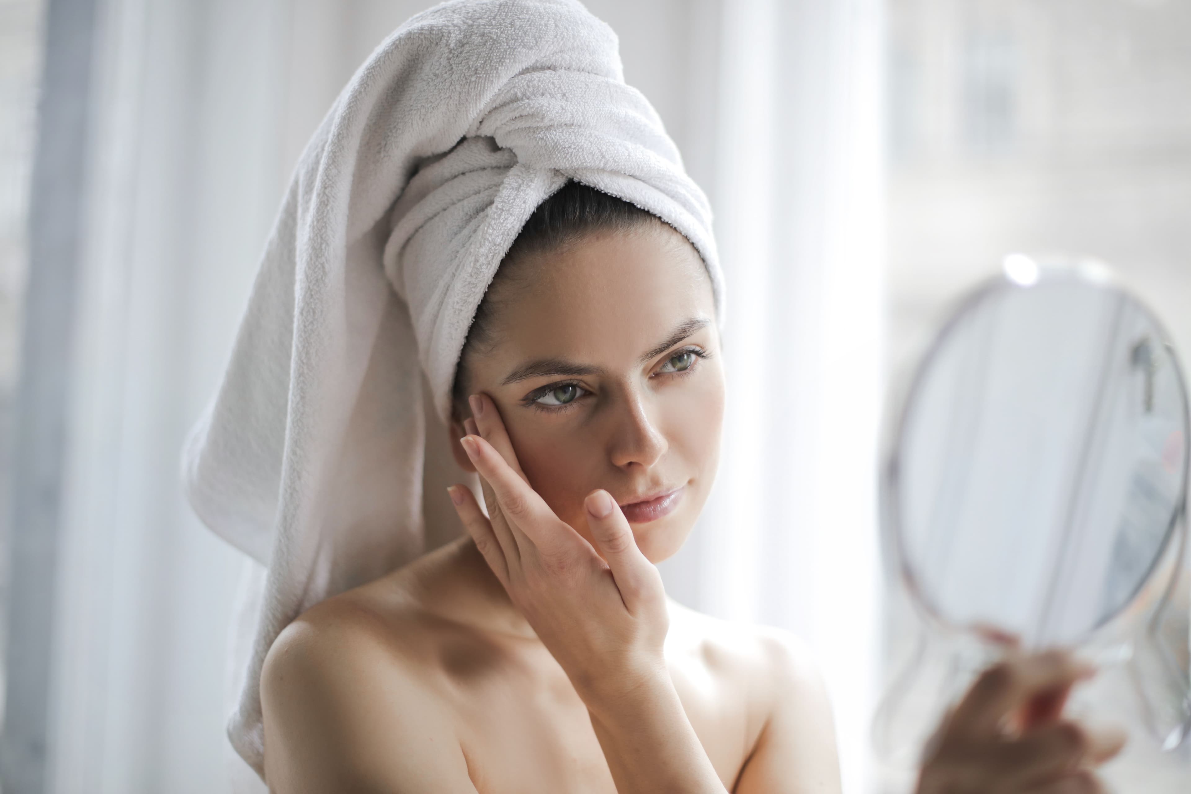 Minimal, fragrance-free skincare products for sensitive skin on a soft neutral background