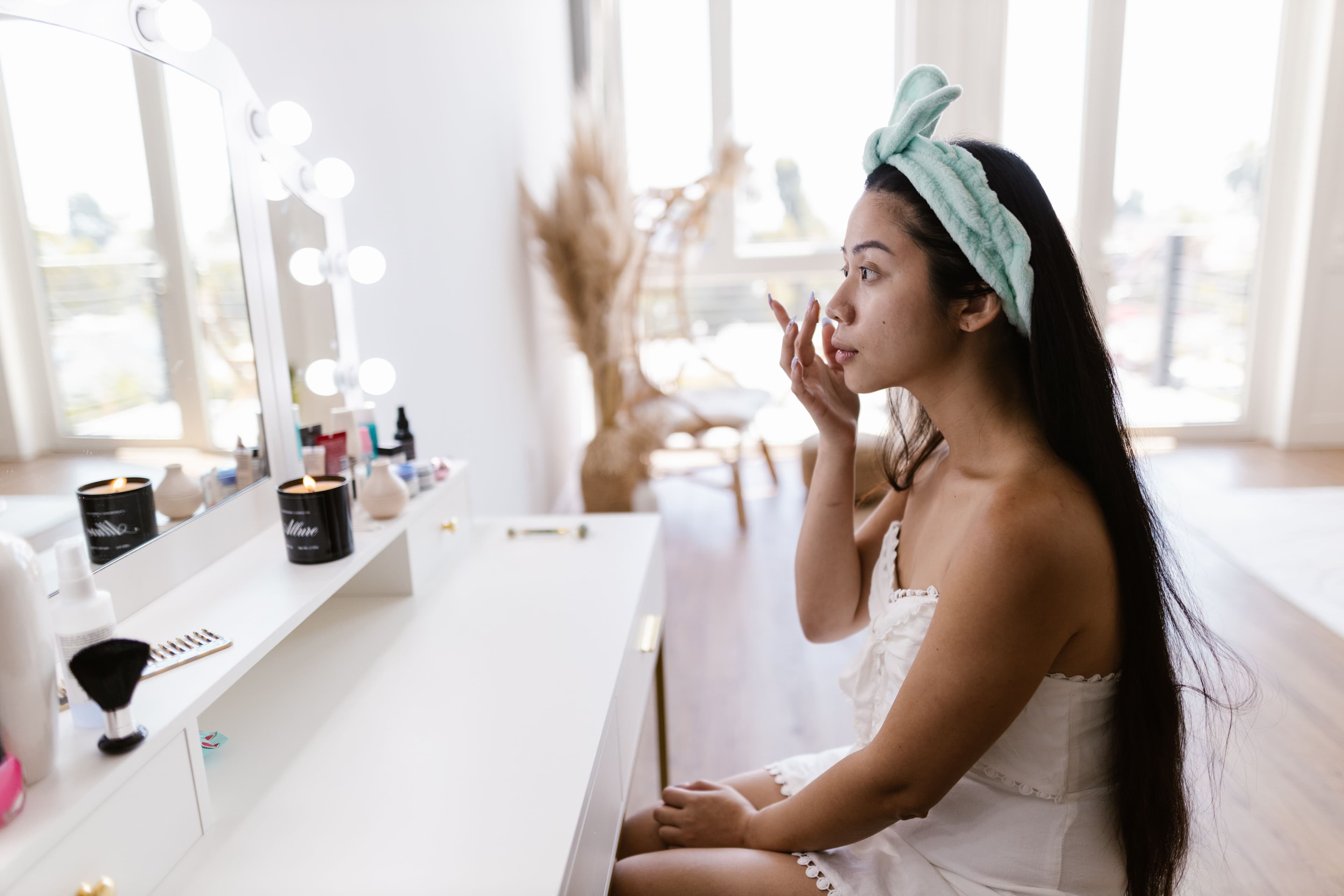 Simple, affordable student skincare products lined up on a dorm room desk